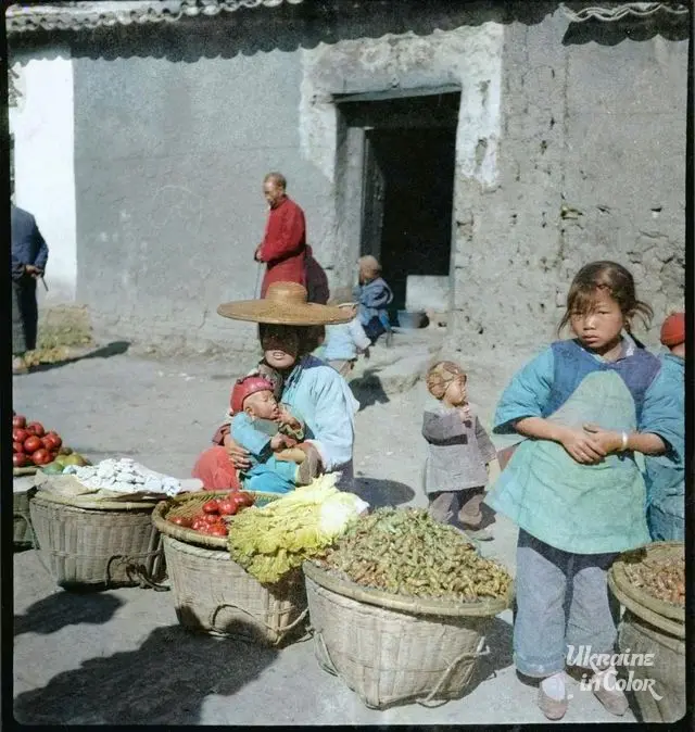 Sofia Yablonska films residents selling fresh fruit at a bazaar in Yunnan Province