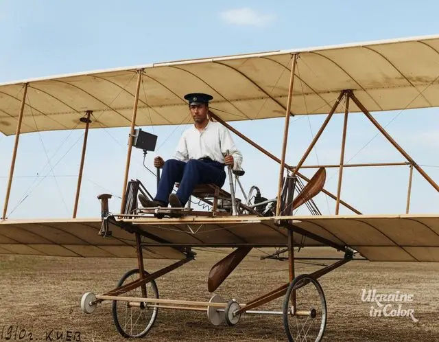 Ihor Sikorsky seated at the forward edge of his first airplane desing, S-1