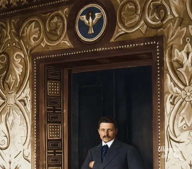 Boychuk against the backdrop of the murals at the entrance to the chapel of the Jacobite Bursa in Lviv