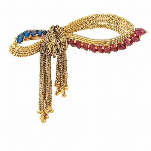 Bow brooch with gold tassels