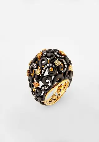 Blackened metal ring set with gems