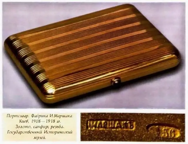 Gold cigarette case with a sapphire