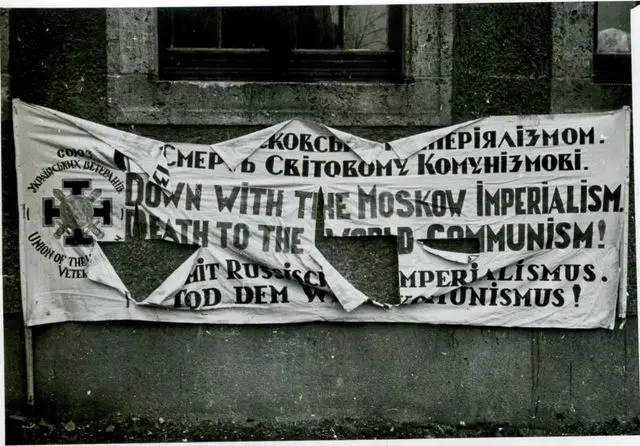 Damaged poster from a Ukrainian march in the British occupation zone