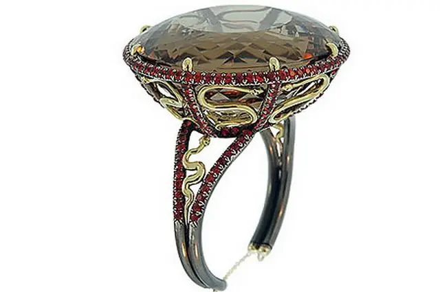 Ring with a large faceted stone